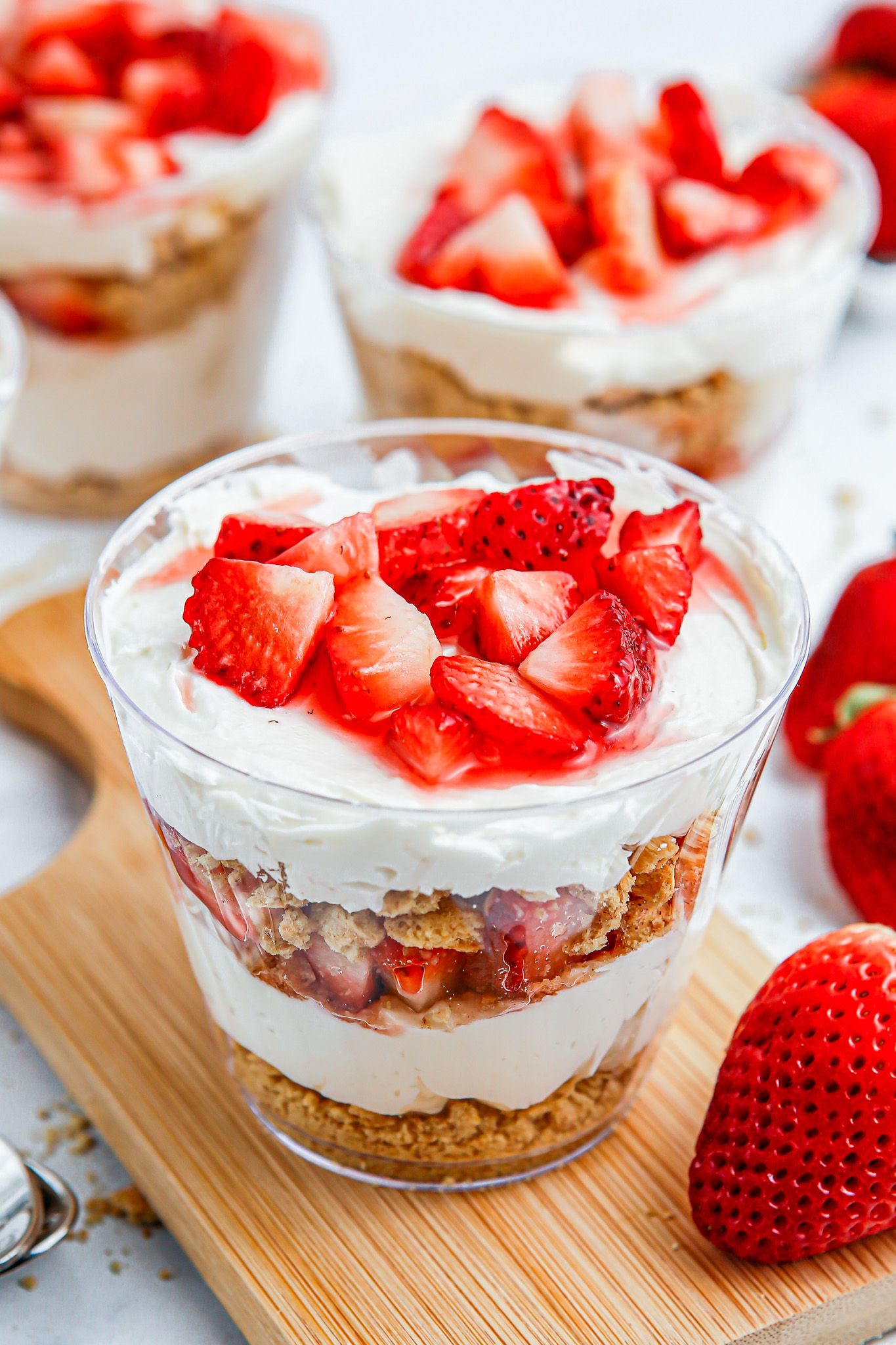 layered cheesecake dessert in clear cup