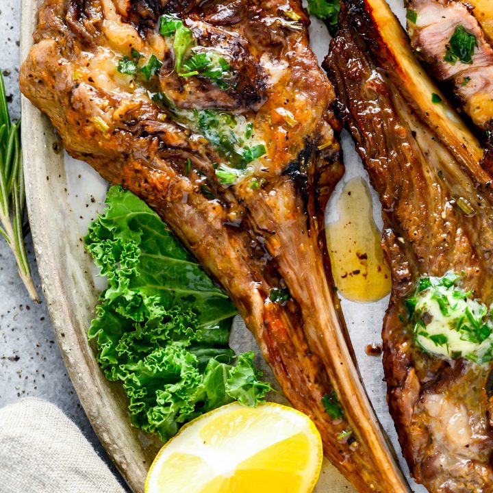 chops topped with butter served on plate
